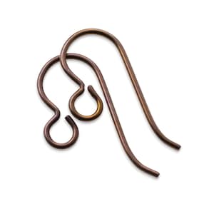 May include: Two bronze-colored earring hooks, displayed against a white background. The hooks are made of thin, curved metal wire. One hook has a looped design, while the other is a simple, elongated curve.