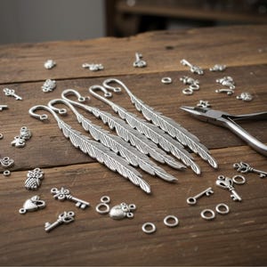 Silver feather bookmarks with engraved details and curved hooks; zinc alloy metal, DIY bookmark kit 5-pack.