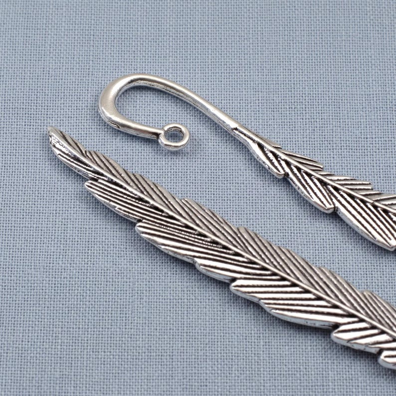 Silver feather bookmarks with engraved details and curved hooks; zinc alloy metal, DIY bookmark kit 5-pack.
