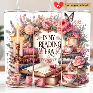 May include: A white tumbler with a floral design and the text "In My Reading Era". The tumbler features a stack of books, a cup of tea, and a butterfly.