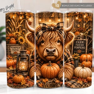May include: A cylindrical tumbler featuring a Highland cow wearing a plaid bow, surrounded by pumpkins, a lantern, and autumn foliage. The design includes text reading "PUMPKIN PATCH" and "FARM FRESH PUMPKINS" against a rustic wooden background.