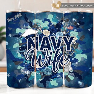 May include: Navy Wife tumbler with a blue camouflage design. The tumbler features the words "Navy Wife" in a decorative font, along with nautical elements like anchors, a ship's wheel, and a sailor's hat. The design includes stars and floral accents.