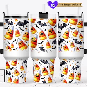 May include: White tumbler with a Halloween-themed design. The design features cartoon candy corn with various expressions and black bats on a white background. The tumbler has a black handle and a straw. Text on the top reads "12 free designs included".