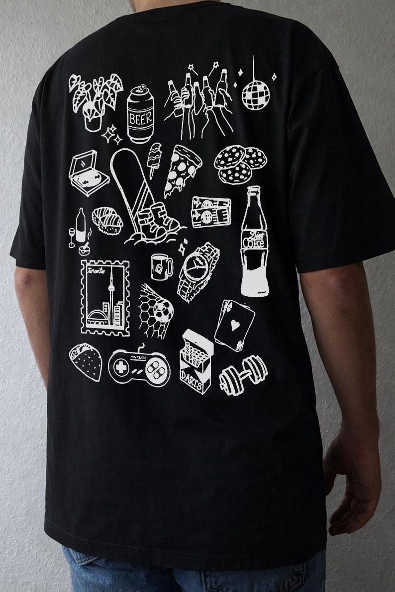 May include: Black t-shirt with a white graphic design featuring various icons such as a beer can, pizza slice, watch, and a video game controller. The shirt has a crew neck and short sleeves.