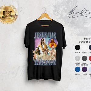 May include: Black t-shirt with a graphic design featuring images of Jesus and the text "JESUS HAS RIZZAEN" in a stylized font. The shirt includes a color chart with options like black, white, and navy.