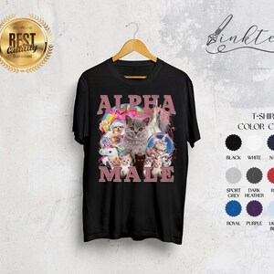May include: Black t-shirt with a graphic of a group of cats with the text "ALPHA MALE" in pink letters.