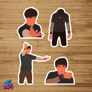 May include: Four stickers showing stylized illustrations of a person in different poses. The person has orange skin and dark brown hair, wearing a black shirt with tan sleeves. The stickers are set against a wooden background.