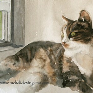 May include: Watercolour painting of a tabby cat with green eyes, lying down and looking to the right. The cat is mostly white with brown and black stripes. The cat is lying on a light grey surface near a window.
