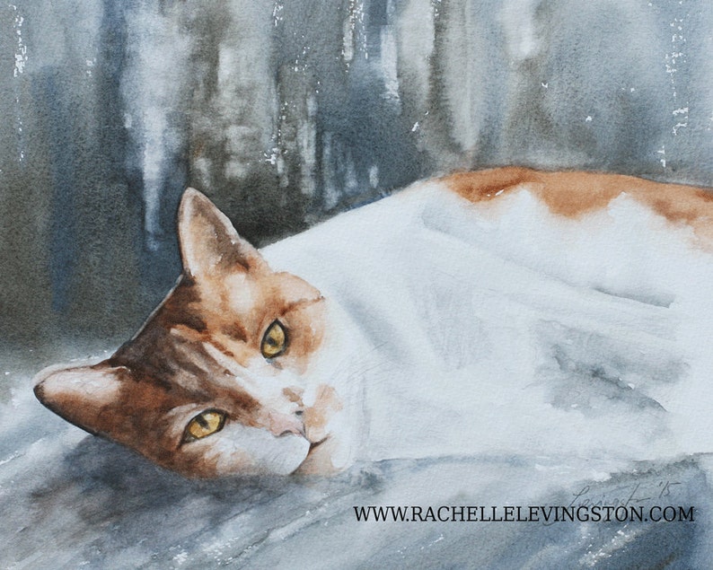 May include: Watercolour painting of a white and orange cat lying down with its head turned to the side. The cat has yellow eyes and a soft, fluffy coat. The background is a blurry watercolour wash of blue and grey.