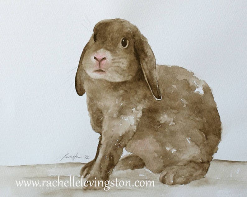 May include: Watercolor painting of a brown rabbit with floppy ears, sitting on a white background. The rabbit has a pink nose and brown eyes.