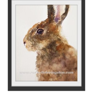 May include: Watercolor painting of a brown rabbit with a white background. The rabbit's fur is painted with shades of brown, and its eyes are dark. The rabbit's ears are long and pointed.
