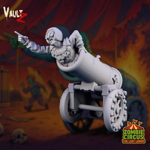 Puede incluir: Modelo impreso en 3D de un payaso zombi saliendo de un cañón blanco. El payaso lleva un casco y señala. El cañón tiene ruedas. La imagen incluye el texto "VAULT Z" y "ZOMBIE CIRCUS THE LAST LAUGH".