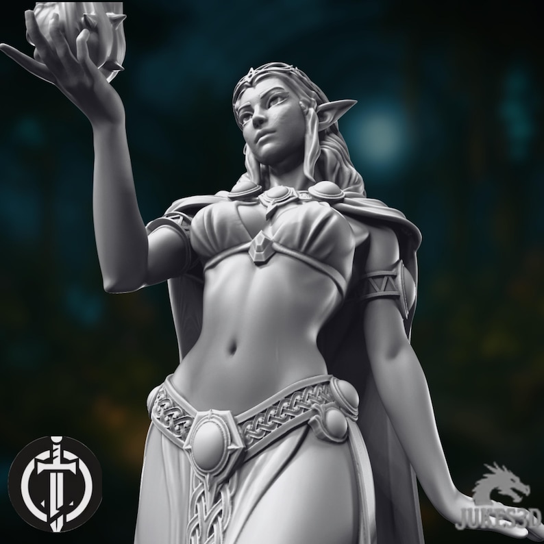 May include: A grayscale figurine of a female elf holding a glowing orb. The elf is adorned with a crown, cape, and detailed clothing. The figure has pointed ears and is in a dynamic pose. A logo with a sword is visible in the lower left corner.