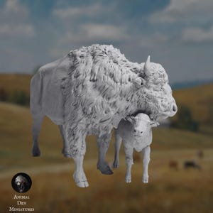 May include: A detailed, gray miniature sculpture of a bison and calf. The adult bison has a shaggy coat and curved horns, with the calf nestled close. The Animal Den Miniatures logo is in the lower left corner.