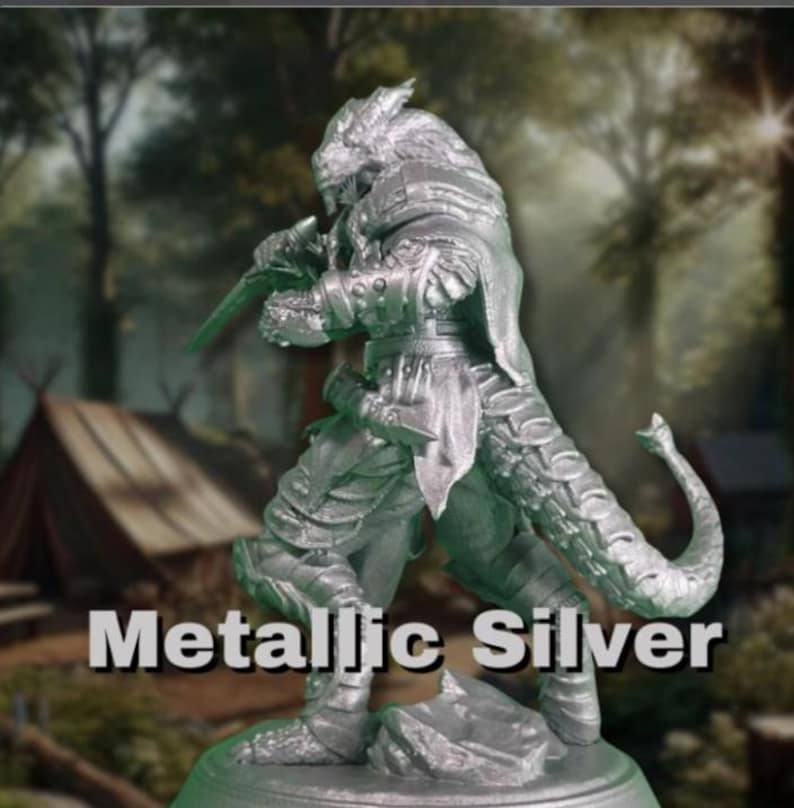 May include: Metallic silver figurine of a fantasy warrior, holding a sword. The figure has a reptilian tail and detailed armor. The text "Metallic Silver" is displayed at the bottom of the image. The background is a blurred forest scene.
