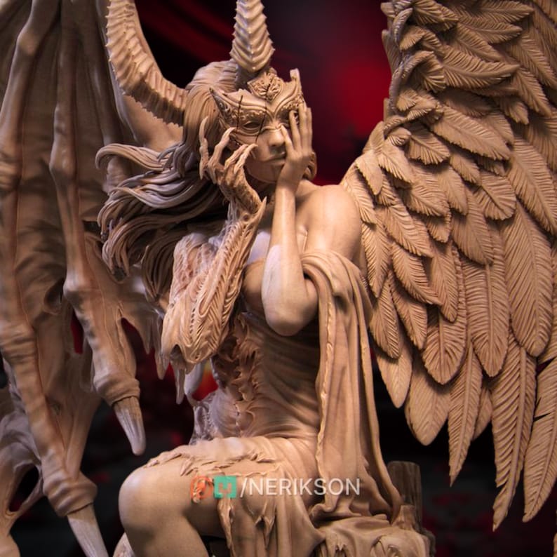 May include: A detailed sculpture of a winged figure with intricate details. The figure is seated, with one hand covering the face. The wings are large and feathered, and the figure wears a crown and mask. The sculpture is in shades of brown.