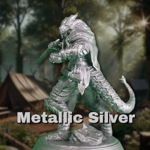 May include: A metallic silver miniature figurine of a dragon-like creature with a long tail and a sword in its hand. The figurine is standing on a rocky base.