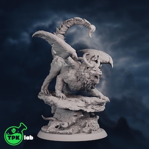 May include: A detailed, white figurine of a mythical creature with a lion's body, wings, and a scorpion tail. The creature is perched on a rocky base, with horns and an open mouth. The TPK lab logo is in the bottom left corner.