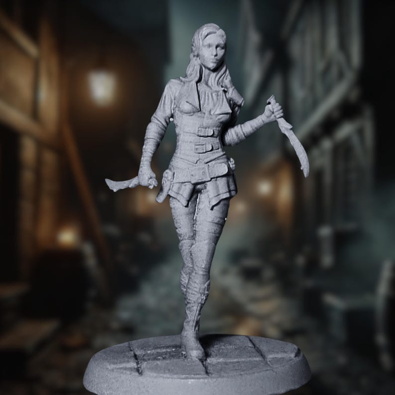 Female rogue miniature holding two curved daggers, walking forward on a cobblestone base with a dark alley background.