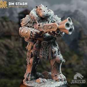 May include: A detailed 3D-printed figurine of a hippopotamus-like creature in ornate armor, holding a multi-barreled firearm. The figure is gray with intricate detailing, standing on a rocky base. The text "DM STASH PRINT.PAINT.PLAY" is visible.
