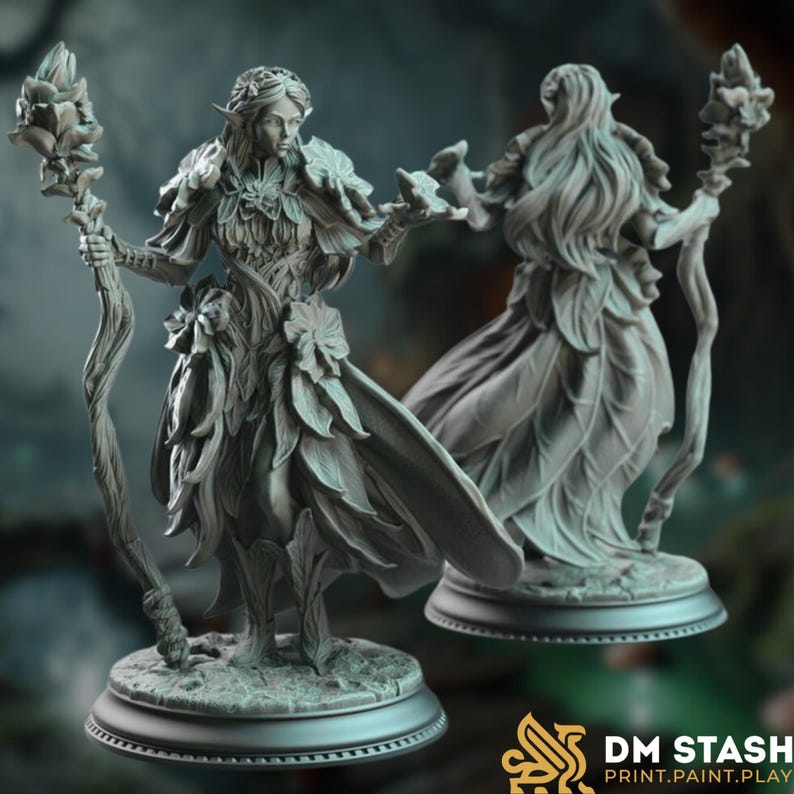 Front and rear render of the Feywalker miniature, a graceful fae spellcaster adorned in layered leaf robes and crowned with petals. She holds a gnarled staff with blooming flowers and extends one hand in a gesture of magic.