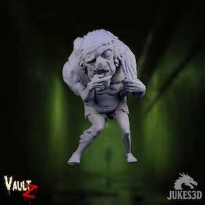 May include: A gray, 3D-printed figurine of a grotesque humanoid creature. The figure has a hunched posture, with a wrinkled face, and is clutching a piece of fabric. The Vault Z and Jukes3D logos are visible.