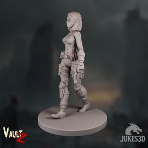 A female survivor miniature wearing tactical gear and a face mask, holding a pistol in one hand and standing ready in a confident pose. The post-apocalyptic city skyline behind her fades into dusk.