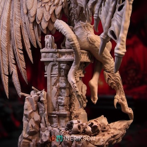 May include: A detailed, beige-colored fantasy sculpture featuring a winged creature perched atop a crumbling stone structure. The sculpture includes intricate details of feathers, claws, and skeletal elements. The base of the sculpture has the text "@YNERIKSON".