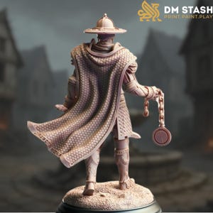 May include: A detailed miniature figure of a warrior wearing chainmail armour and a cloak, holding a chain with a circular weight. The figure is standing on a round base.