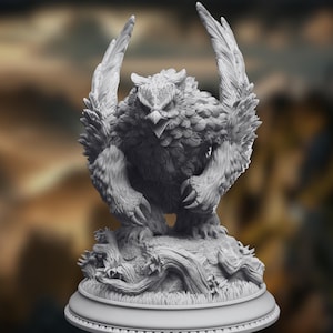 May include: A detailed, gray sculpture of an owl-like creature with outstretched wings and sharp talons. The figure is perched on a base with a tree trunk and foliage, showcasing intricate feather and fur details. The sculpture has an intense, focused expression.