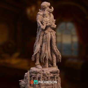 Full frontal view of the assembled miniature on a jagged stone base, with the couple’s faces gently pressed together.