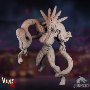 Puede incluir: Figura beige de una mujer con pelo largo, un tocado y una serpiente enrollada alrededor. La figura sonríe y parece estar en movimiento. Los logotipos de Vault Z y Jukes3D son visibles.