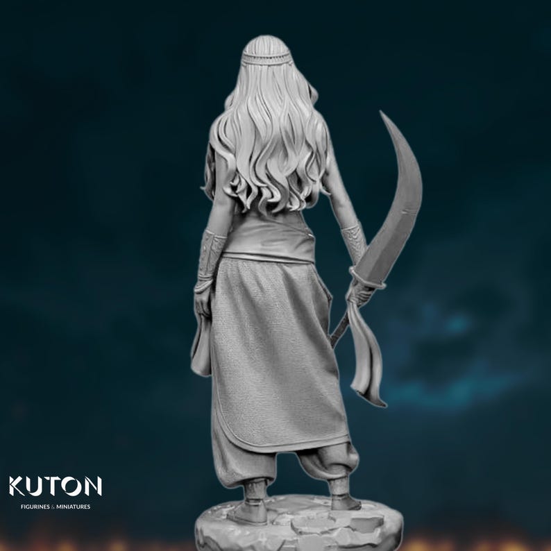 Back view of the assembled warrior model showing intricate hair detail, loose desert pants, and curved sword in hand.