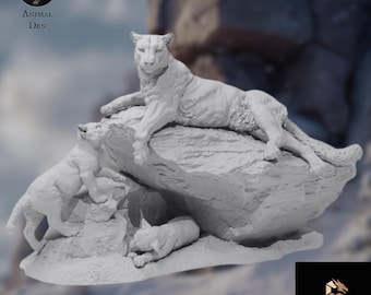 May include: A detailed sculpture of a cougar and her cubs resting on a rock formation. The cougar is lying down, while two cubs are playing nearby. The sculpture is a light gray color and has a realistic appearance. The image includes the text "Animal Den" and "Jukes3D Studio".