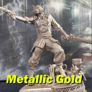 May include: Metallic gold figurine of a cat-like humanoid figure holding two antique firearms. The figure is wearing detailed armor and standing on a decorative base. The text "Metallic Gold" is displayed in a yellow font at the bottom of the image.