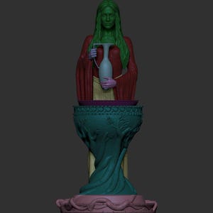 Colour-coded digital 3D model render showing the separate printable parts of the elven priestess miniature. The figure body is shown in green, outer robe in red, skirt section in yellow, ewer in light teal, hands in purple, pedestal bowl and stem in dark teal, and base in pink. Dark grey background.