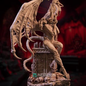 May include: A detailed sculpture of a seated demonic figure with large, textured wings and horns. The figure is posed atop a stone structure, with intricate detailing on the body and wings. The sculpture has a neutral color palette.