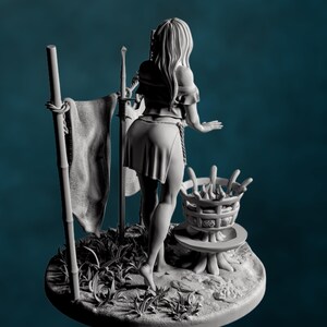 Back side of clothed version of outdoor bathing woman pinup, showing skirt detail and wood-textured base with fire basin.
