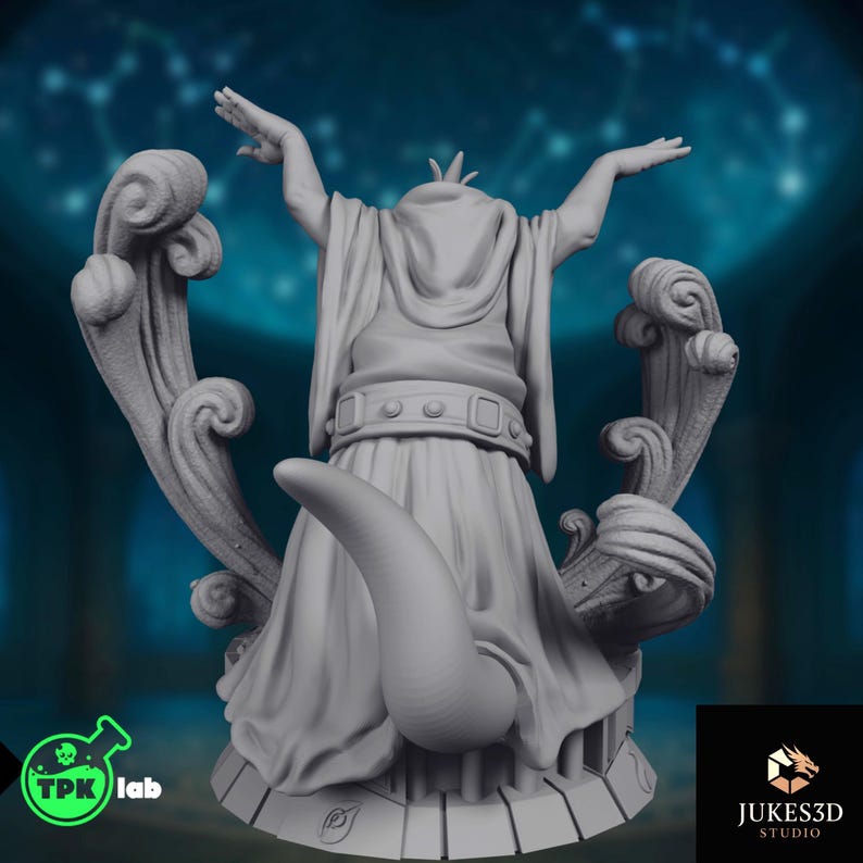 Rear view showing robed frog priest miniature with sculpted tail, sweeping decorative forms, layered cloth folds, and elaborate scenic base details.