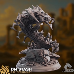 May include: A detailed, grey 3D-printed model of a monstrous creature with multiple legs, a segmented body, and sharp, spiky protrusions. The model is mounted on a rocky base. The text "DM STASH PRINT.PAINT.PLAY" is visible.
