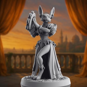 May include: A gray figurine of a rabbit-like creature in a flowing gown, holding a circular object. The figure has large ears and is posed in a graceful stance. The statue is on a round base.
