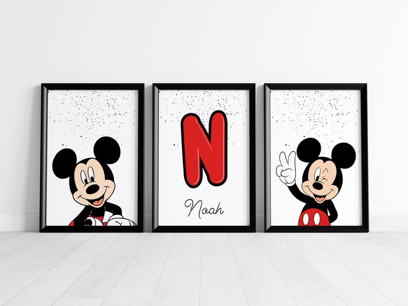 May include: Three framed prints featuring Mickey Mouse. One print shows Mickey smiling, another displays a red letter "N" with the name "Noah", and the third has Mickey giving a peace sign. All prints have a white background with black speckles.