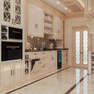 May include: A luxurious kitchen with cream-colored cabinetry and a marble floor. The cabinets feature glass-fronted doors and intricate detailing. A built-in oven and a wine cooler are visible. The kitchen is well-lit and has a classic, elegant design.