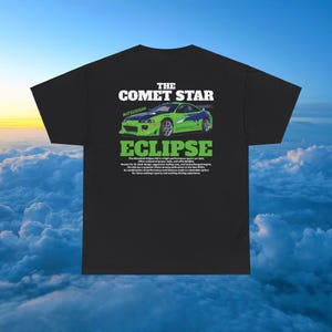 May include: Black t-shirt featuring a green Mitsubishi Eclipse car graphic and the text "The Comet Star Eclipse" with a description of the car.