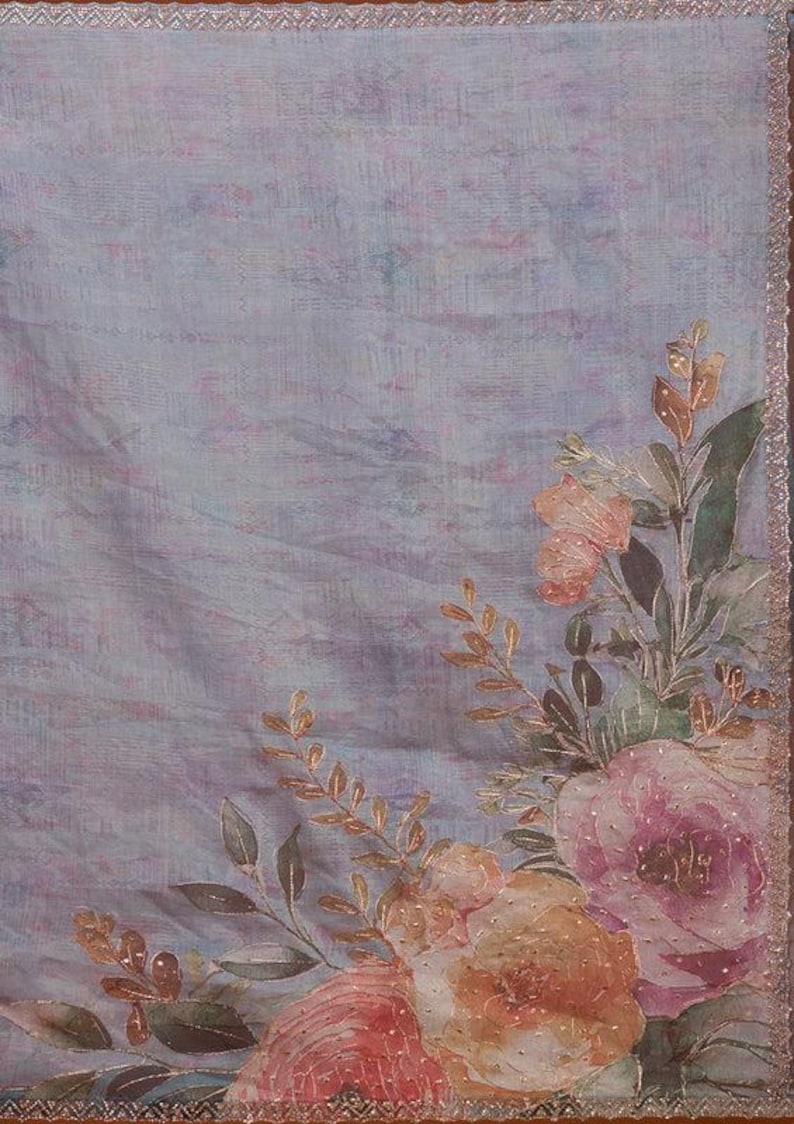 May include: A light lavender fabric featuring a watercolor-style floral print in shades of peach, pink, and green. The design includes detailed roses and foliage with subtle gold accents and a decorative metallic trim along the straight edges.