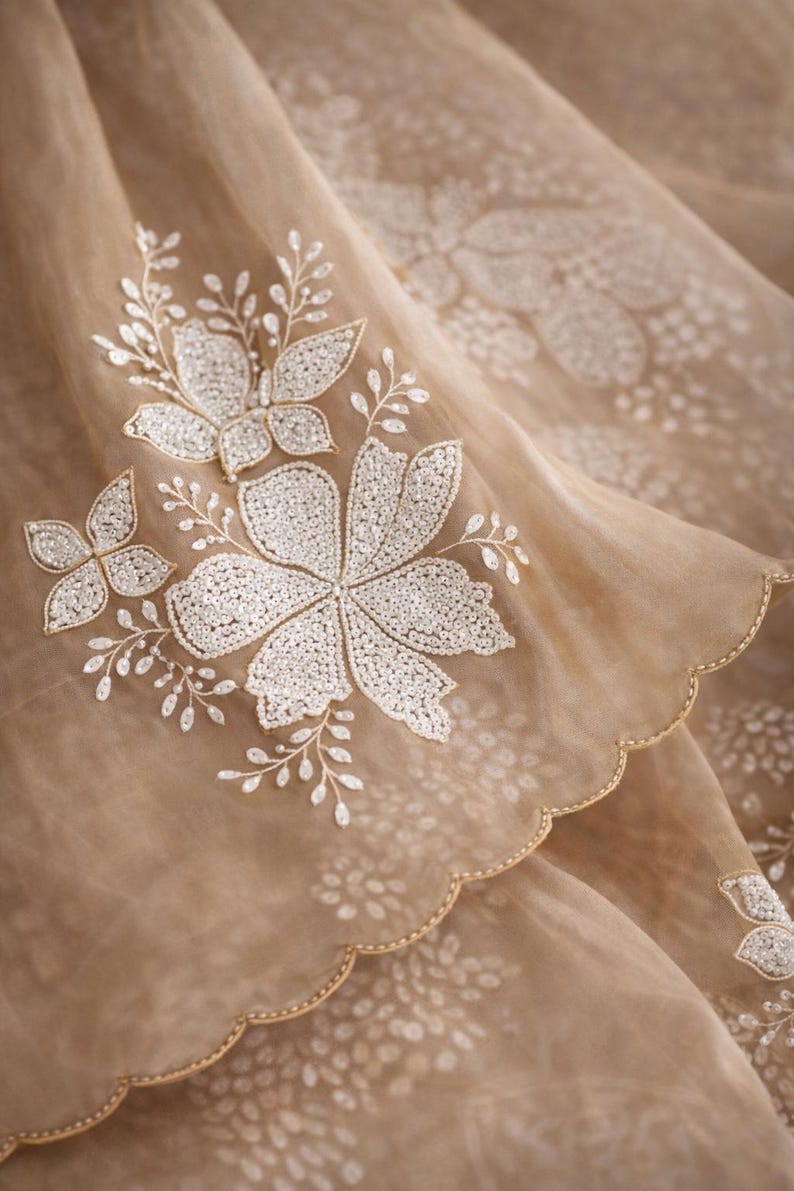 May include: A white ceramic mug with a black handle and the text "But First, Coffee" in a black, handwritten-style font. The mug is on a white surface.