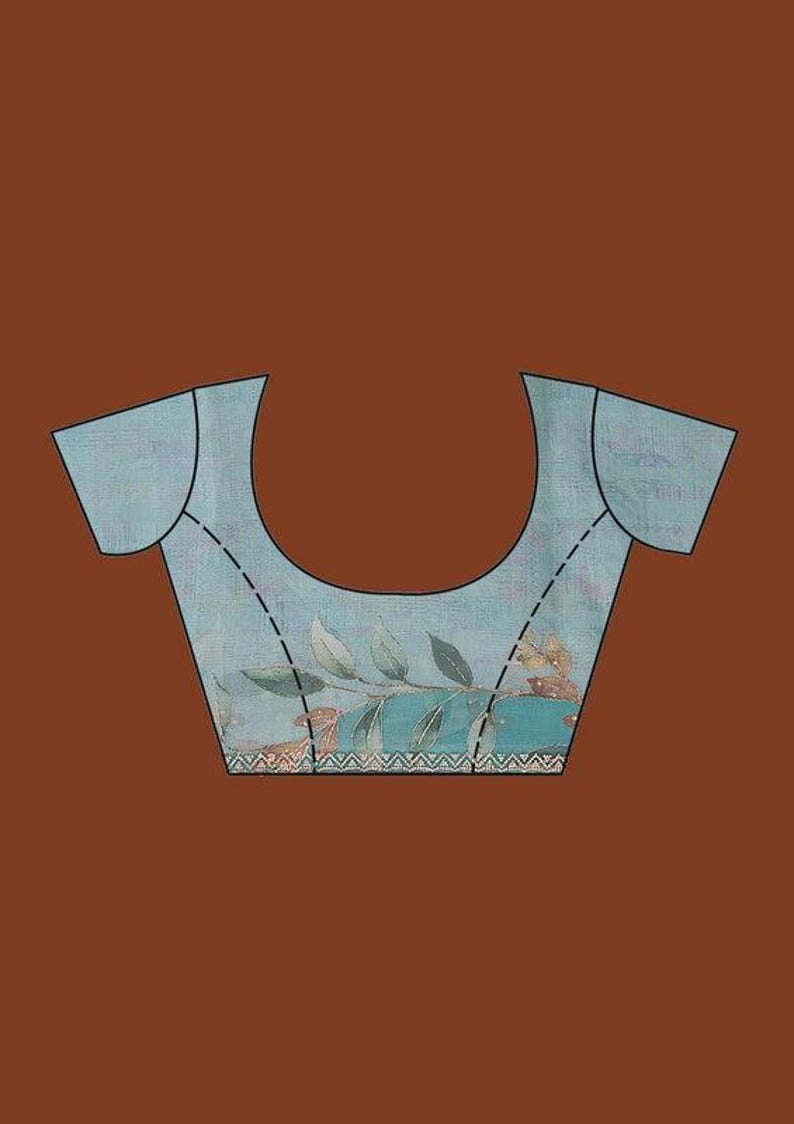 May include: A light blue blouse with short sleeves and a scoop neckline. The fabric features a printed pattern of green and brown leaves across the lower section, finished with a decorative white and black geometric border along the bottom hem.