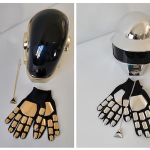May include: Two Daft Punk helmets, one black and one silver, with matching gloves. The gloves have gold and silver accents.