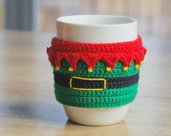 Weihnachtliche Häkeltasse Gemütlich mit Glöckchen: Rot, Grün, Schwarz und Gelb