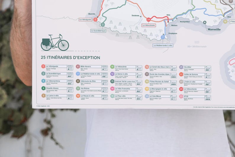 May include: A map of 25 cycling routes in the French Riviera, with a bicycle illustration at the top. The map is titled "25 Itineraires d'Exception".